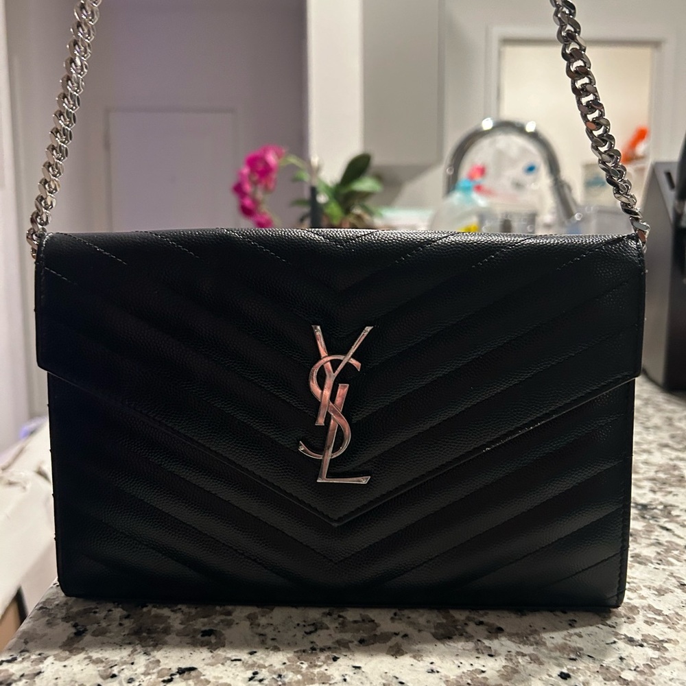 Saint Laurent Black Crossbody Bag with Quilted Texture and Gold Logo